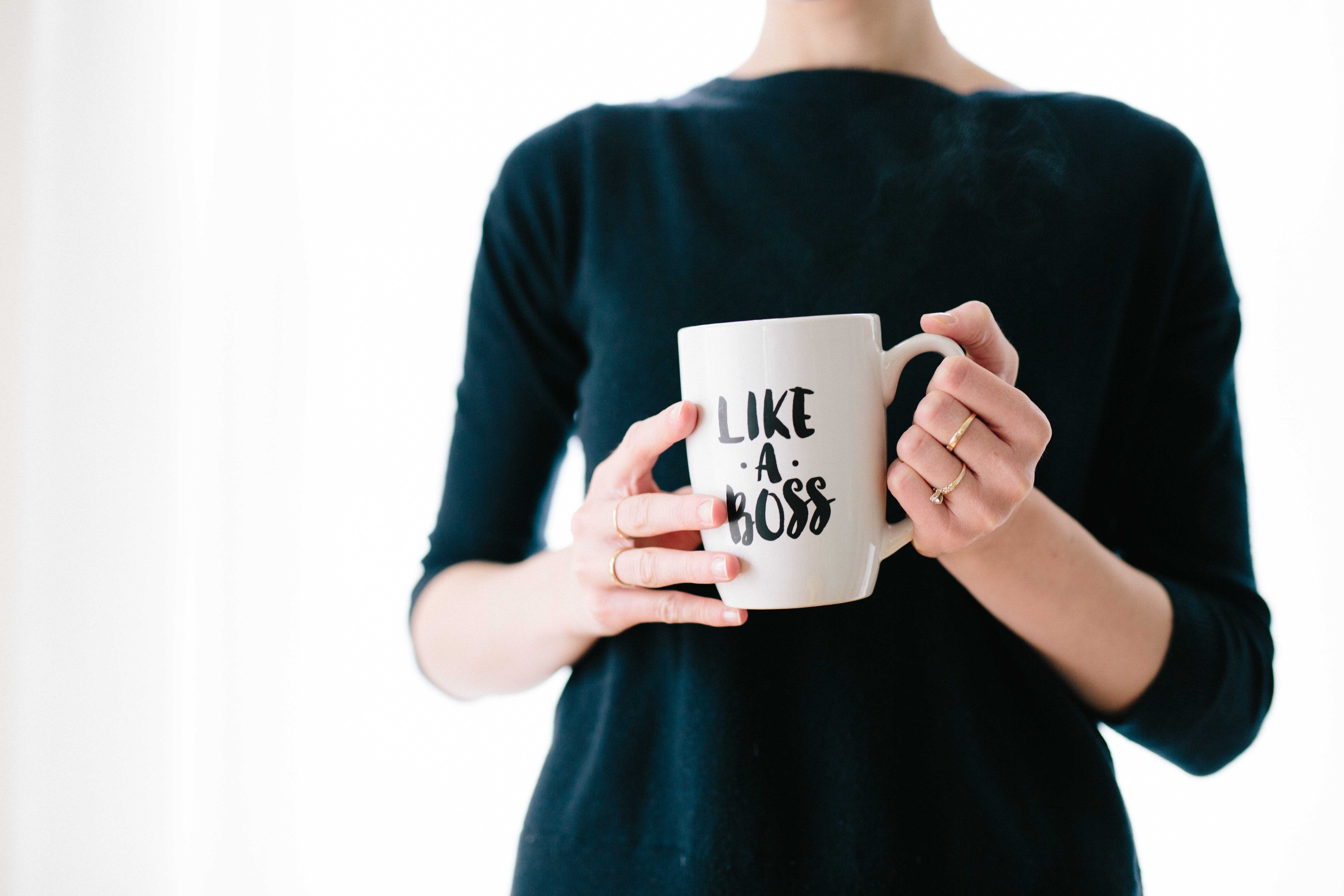 woman holding like a boss mug